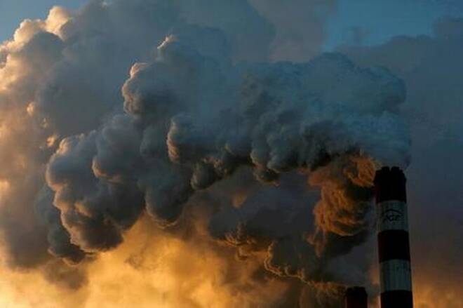 FILE PHOTO: Smoke and steam billow from Poland's Belchatow Power Station, Europe's largest coal-fired power plant