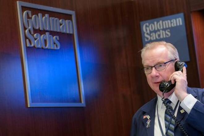 A trader works inside the Goldman Sachs booth