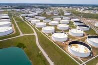 Crude oil storage tanks are seen in an