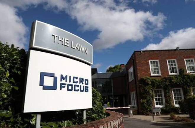 Signs stand outside the offices of Micro Focus