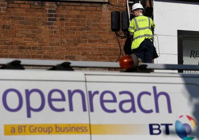 A BT openreach engineer works on a telephone line in