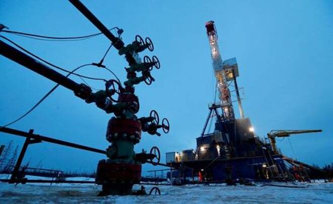 A well head and drilling rig in the