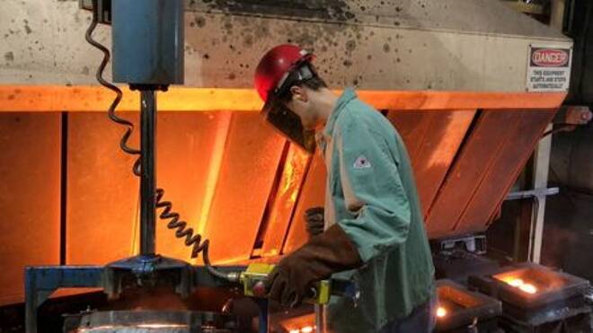 A worker pours hot metal at the Kirsh