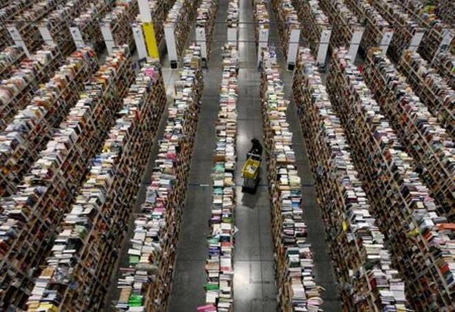 FILE PHOTO: Worker gathers items for delivery at Amazon's distribution