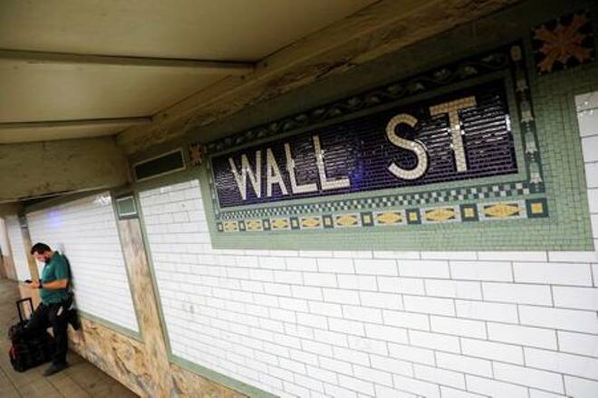 A person waits on the Wall Street subway platform in the Financial District of Manhattan, New York City