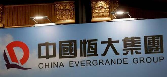 FILE PHOTO: A logo of China Evergrande Group is displayed at a news conference on the property developer's annual results in Hong Kong