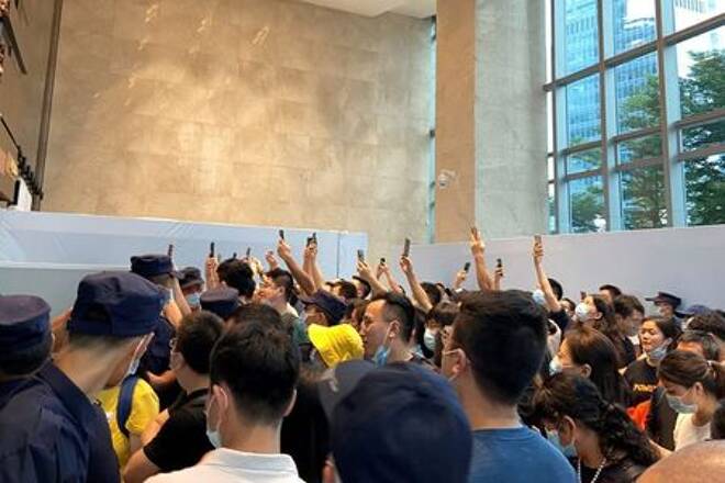 People protest to demand repayment of loans and financial products at the Evergrande's headquarters, in Shenzhen