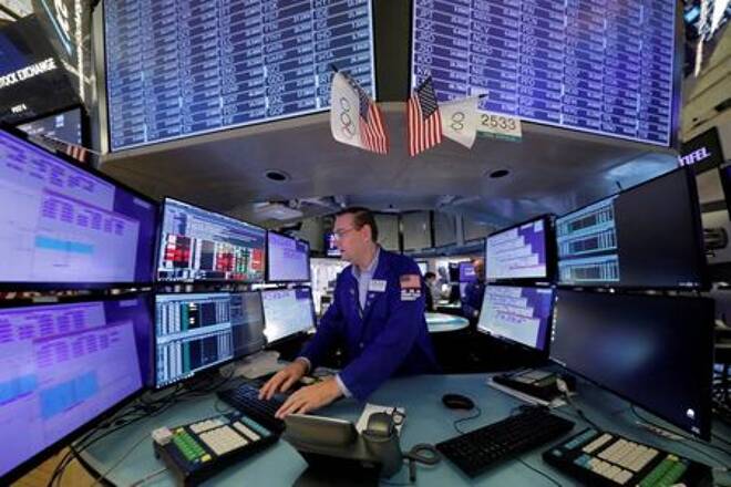 FILE PHOTO: A trader works at the New York Stock Exchange (NYSE) in Manhattan, New York City