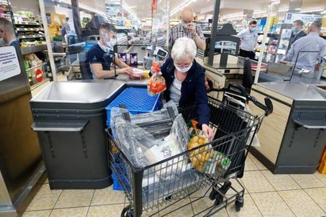 FILE PHOTO: Customers at the food discounter ALDI buy groceries, as the spread of coronavirus disease (COVID-19) continues, in Duesseldorf