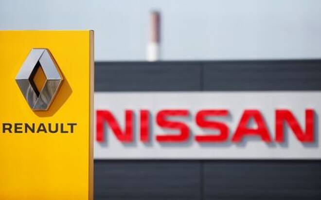 The logos of car manufacturers Renault and Nissan are seen in front of dealerships of the companies in Reims