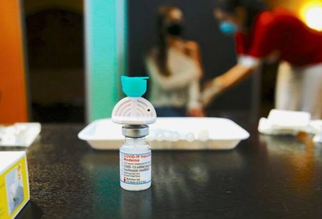 FILE PHOTO: A vial containing the Moderna COVID-19 vaccine is seen at a temporary vaccination center in the Offene St. Jakob Kirche church in Zurich