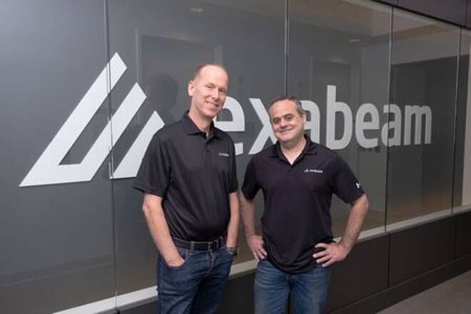 Exabeam CEO Michael DeCesare (L) and chairman and co-founder Nir Polak (R) pose in front of the Exabeam logo in Foster City, California in this undated handout photograph.