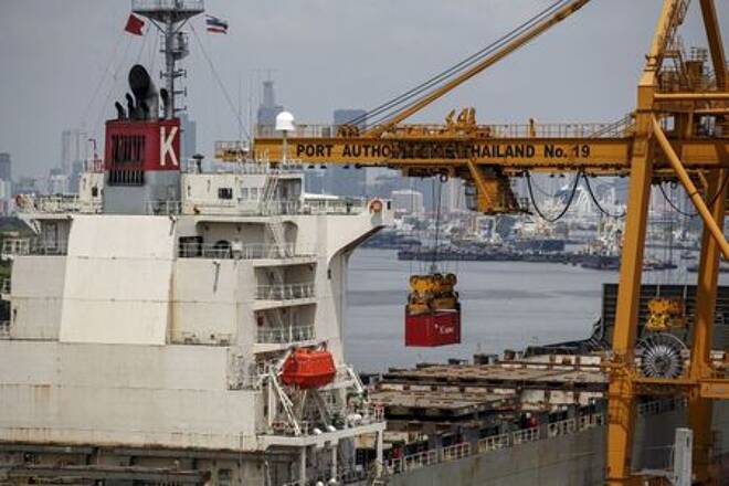 FILE PHOTO: A container is loaded onto a cargo ship