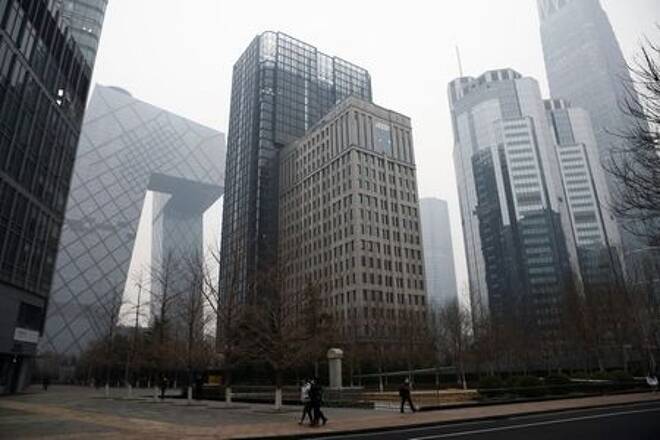 FILE PHOTO: People walk at the Beijing's central business district