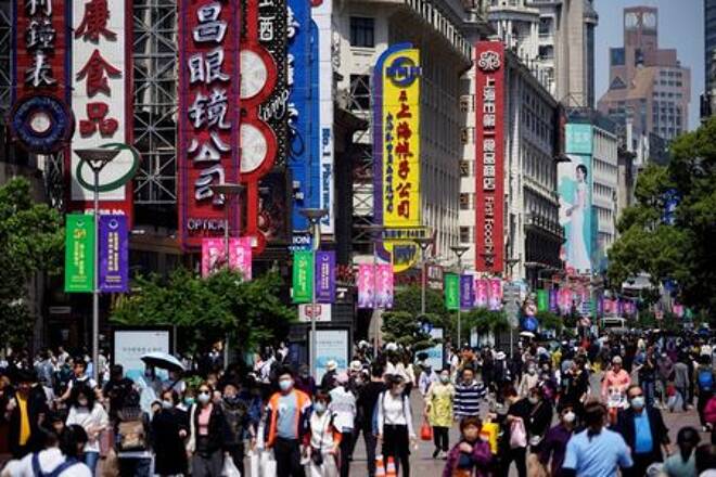 FILE PHOTO: People walk along Nanjing Pedestrian Road during the Labour Day holiday in Shanghai