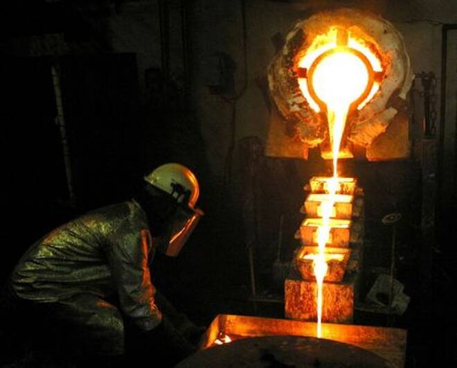 A worker pours gold at the AngloGold Ashanti