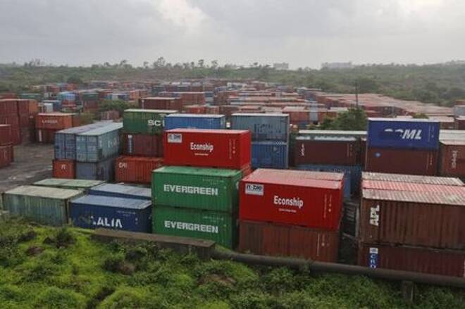 Cargo containers are seen stacked outside the container