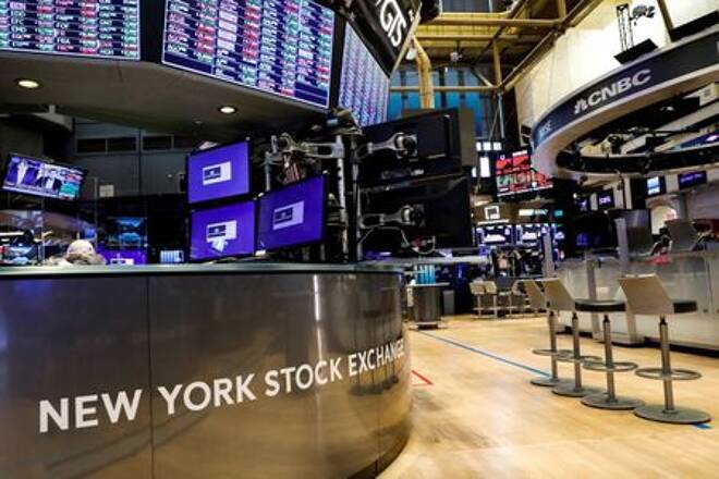 FILE PHOTO: A nearly empty trading floor is seen as preparations are made for the return to trading at the NYSE in New York