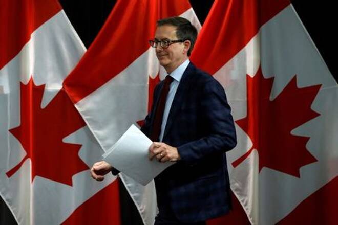 FILE PHOTO: Bank of Canada Governor Tiff Macklem arrives to a news conference in Ottawa