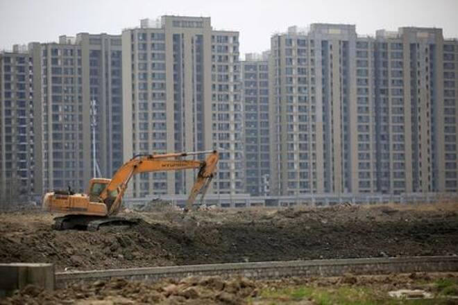 FILE PHOTO: File photo of an excavator at a construction site of new residential buildings in Shanghai