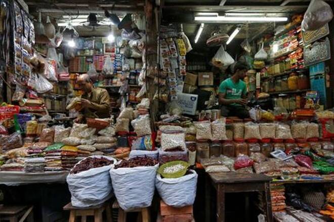 FILE PHOTO: Vendors wait for customers at their respective shops at a retail market in Kolkata