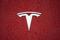 FILE PHOTO: A Tesla logo is seen at the Tesla Shanghai Gigafactory in Shanghai