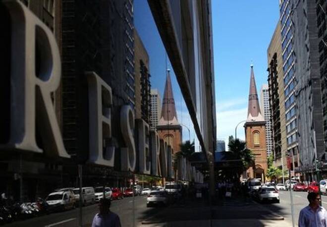 FILE PHOTO: Pedestrians walk past the Reserve Bank of Australia building in central Sydney