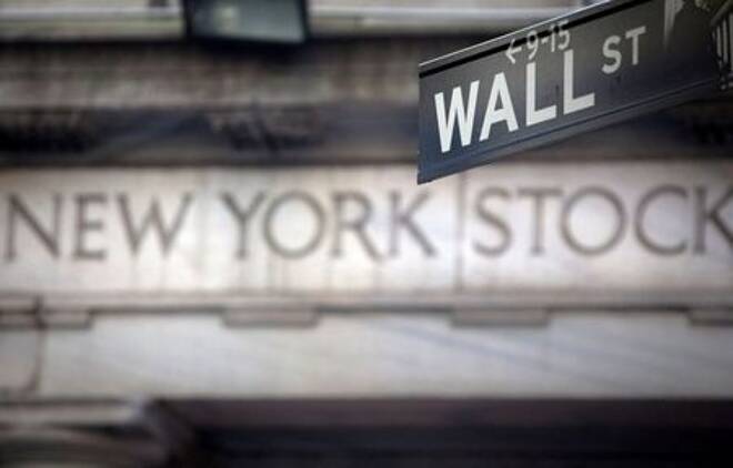 A Wall Street sign is pictured outside the New York Stock Exchange in New York, October 28, 2013. REUTERS/Carlo Allegri