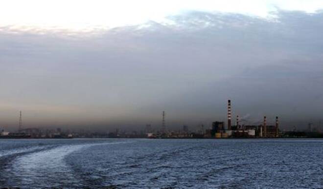 Smoke comes out of an electric plant on the shore of the polluted River Plate in Buenos Aires