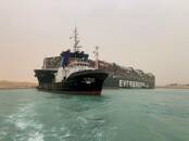 Container ship runs aground in Suez Canal, blocks
