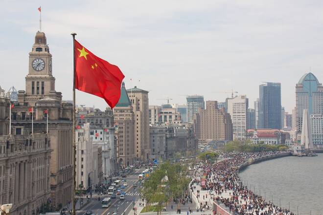 The Bund in Shanghai, China, with Chinese flag