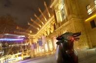 FILE PHOTO: The bull, symbol for successful trading, is seen in front of the German stock exchange in Frankfurt