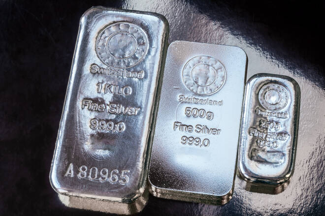Three silver bars of different weight. The surface of cast silver bullion