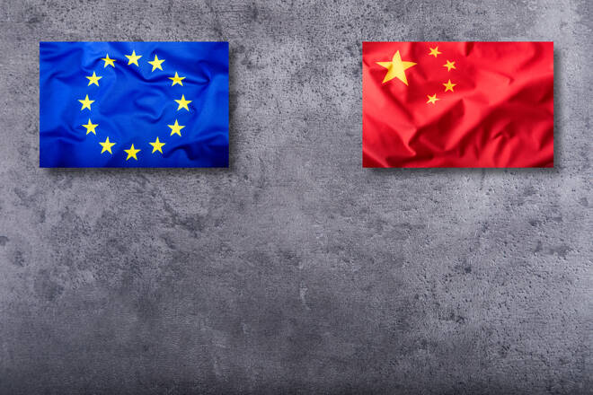 Flags of the China and the European Union on concrete background