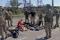 Soldati ucraini arresisi dopo settimane all'interno dell'acciaieria Azovstal sono perquisiti dalla forze pro-russe a Mariupol