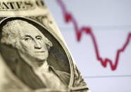 Un dollaro statunitense davanti a un grafico