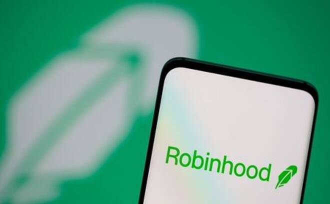 Robinhood-Logo ist auf einem Smartphone vor einem angezeigten gleichen